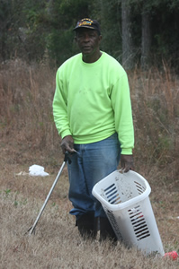 Pastor George Wilson, Jr. picking up litter Hwy 55 Notasulga