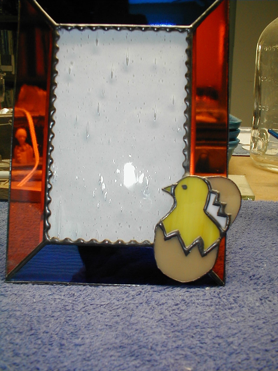 stained glass picture frame with hatching chicken