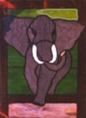 stained glass panel of charging elephant Roll Tide
